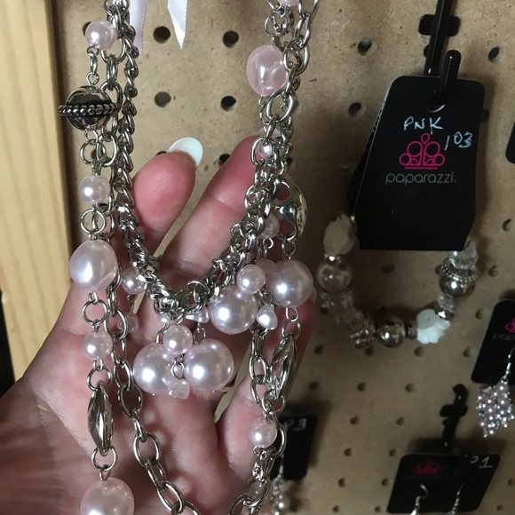 Long pink ribbon tie necklace.